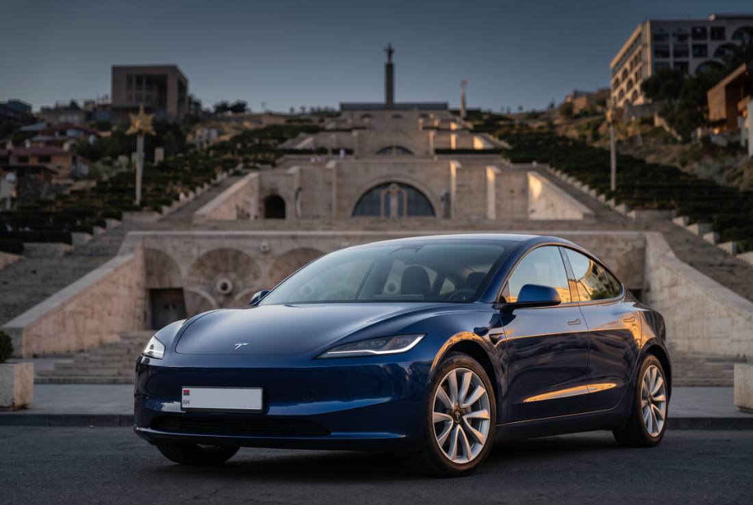 Tesla Model 3, three-quarter front, daylight