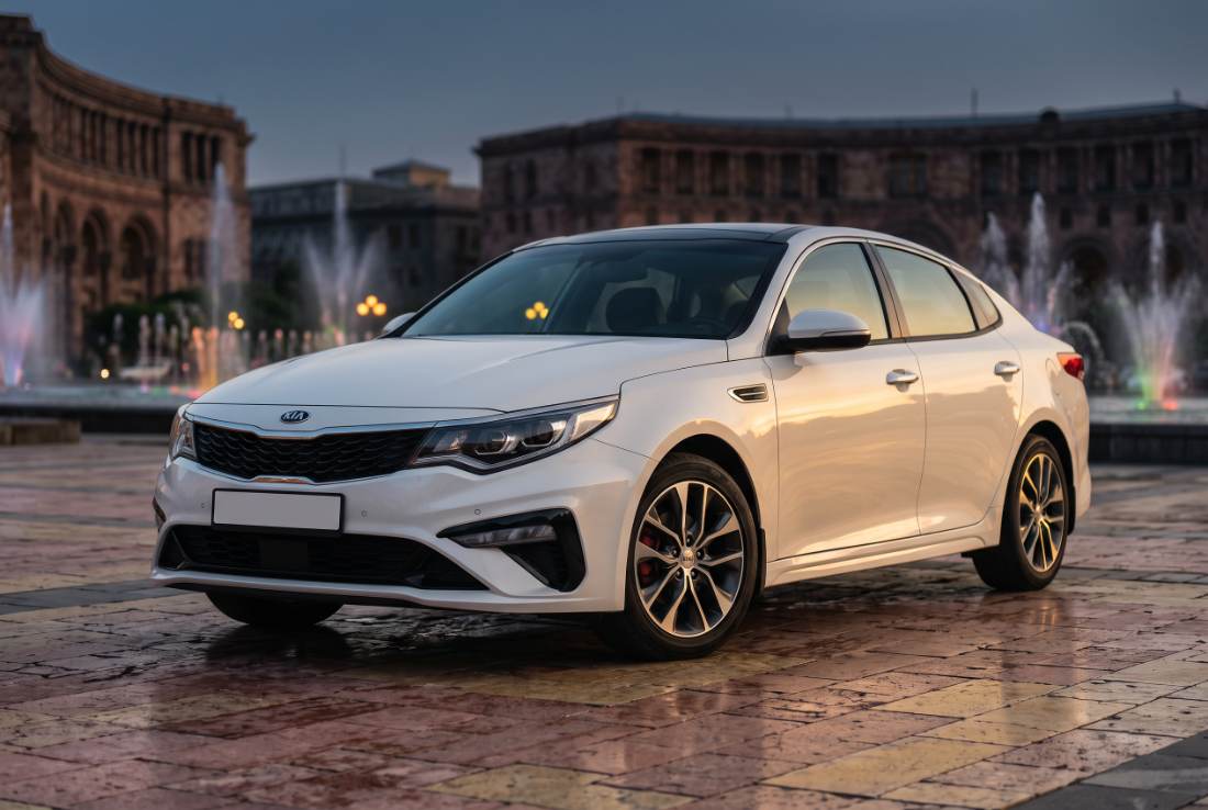 Kia Optima, white, three-quarter front, daylight