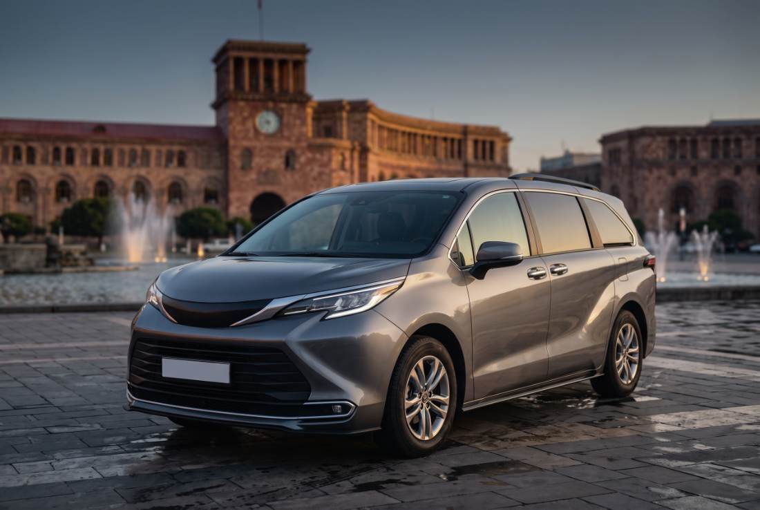 Toyota Sienna hybrid minivan, three-quarter front, daylight